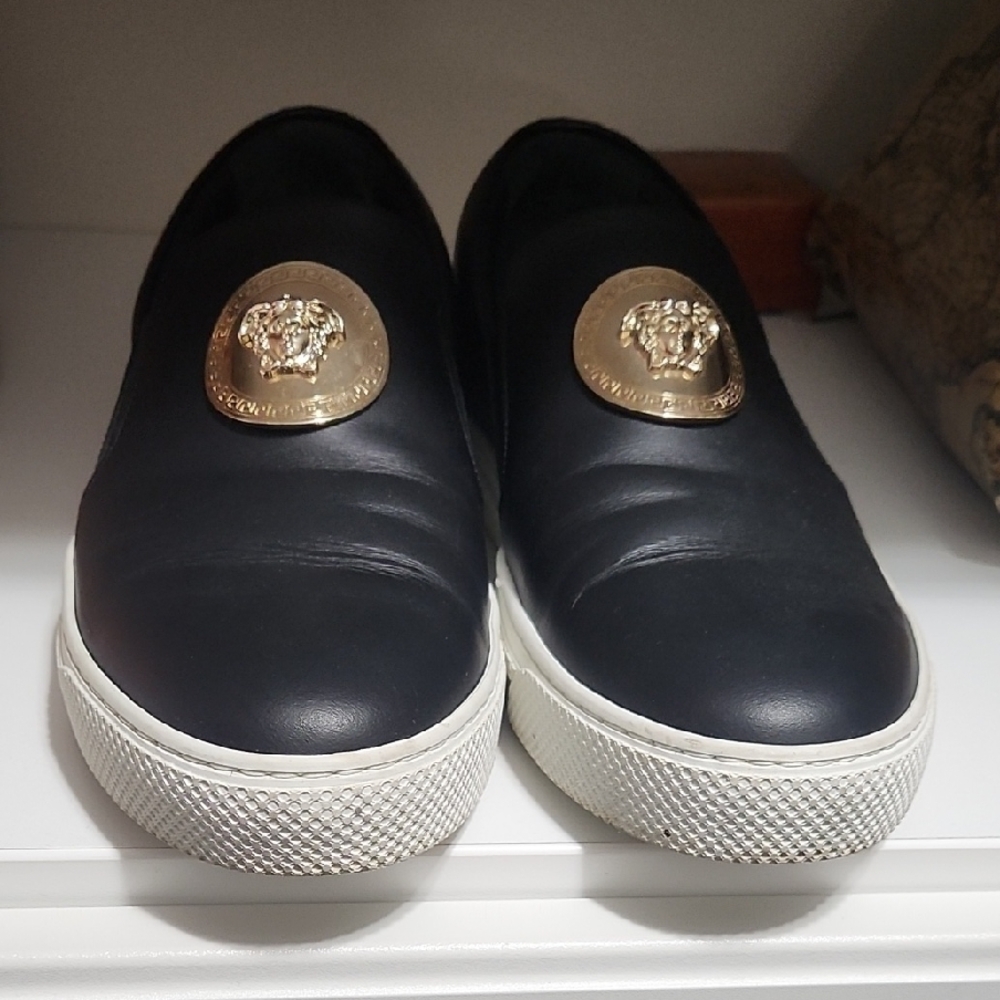Black Leather Slip-On Shoes with Gold Medallion